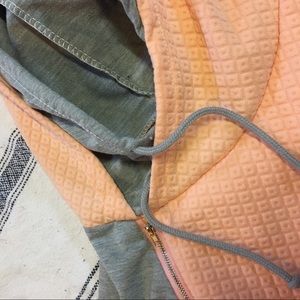 Peach double hooded sweatshirt.